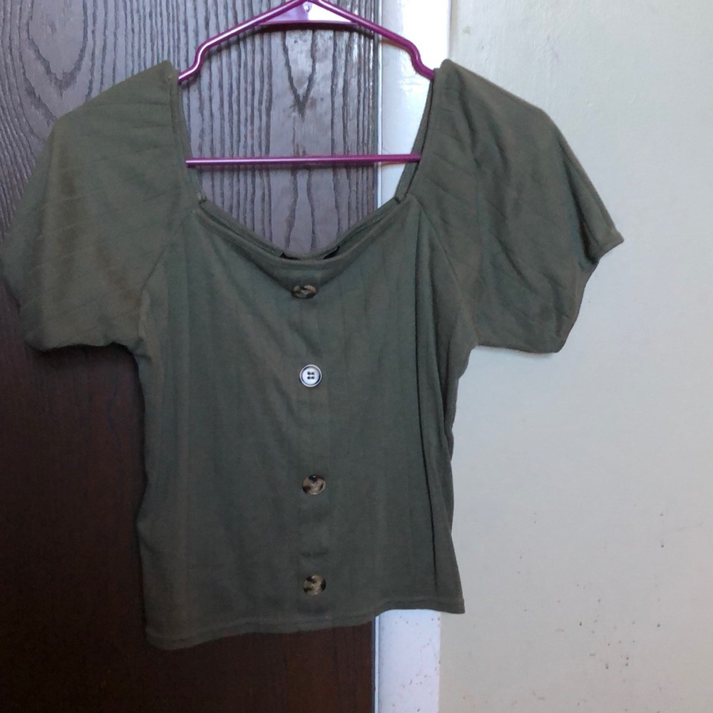 green cropped off the shoulder shirt